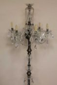 A set of six crystal floor standing candelabra. (6) CONDITION REPORT: Some damages but mostly good