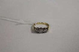 An 18ct gold three-stone diamond ring. CONDITION REPORT: Good condition.