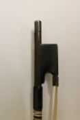 A violin bow by James Tubbs, mounted in white metal with ebony frog, length 74 cm, 60.7g.