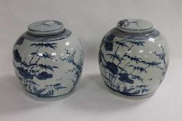 A pair of Chinese blue and white ginger jars, height 28 cm. (2) CONDITION REPORT: Good condition.