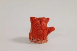 A carved Chinese coral figure depicting a man, height 5.5 cm. CONDITION REPORT: Good condition,