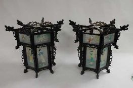 A pair of Chinese wooden and panelled glass lanterns. (2) CONDITION REPORT: Good condition, one