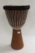 An African Djembe drum, skin diameter 30 cm. CONDITION REPORT: Good condition.