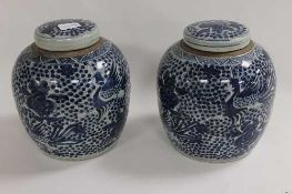 A pair of Chinese blue and white ginger jars decorated with birds and foliage, height 23 cm. (2)