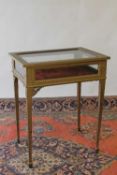 An early twentieth century display table, width 61 cm. CONDITION REPORT: has been painted in gold