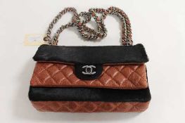 A Chanel brown stitched leather and fur shoulder bag, with authenticity guarantee card no. 10786071.