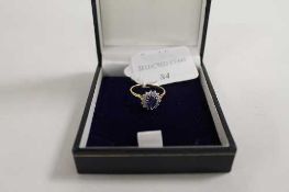 An 18ct gold diamond and sapphire ring. CONDITION REPORT: Good condition.