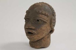 An early twentieth century African terracotta tribal head, height 11.5 cm. CONDITION REPORT: An