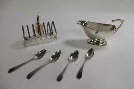 A silver sauce boat, together with a silver toast rack and  four nineteenth century silver