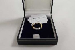 An 18ct gold diamond half eternity ring. CONDITION REPORT: Good condition.