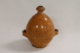 An eighteenth century glazed pottery bottle, height 22 cm. CONDITION REPORT: Incised initial 'T'