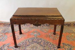 A mahogany carved centre table, width 103 cm. CONDITION REPORT: Missing a few areas of detail and an