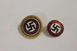 A Third Reich golden party badge of numbered issue type, together with a 1933 NS. DAP badge. (2)