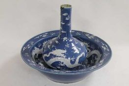 A Chinese blue and white bottle vase, height 34 cm, together with a similar bowl. (2) CONDITION