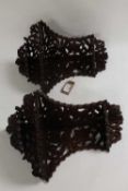 A pair of mahogany fret-work carved corner brackets. (2) CONDITION REPORT: Probably early
