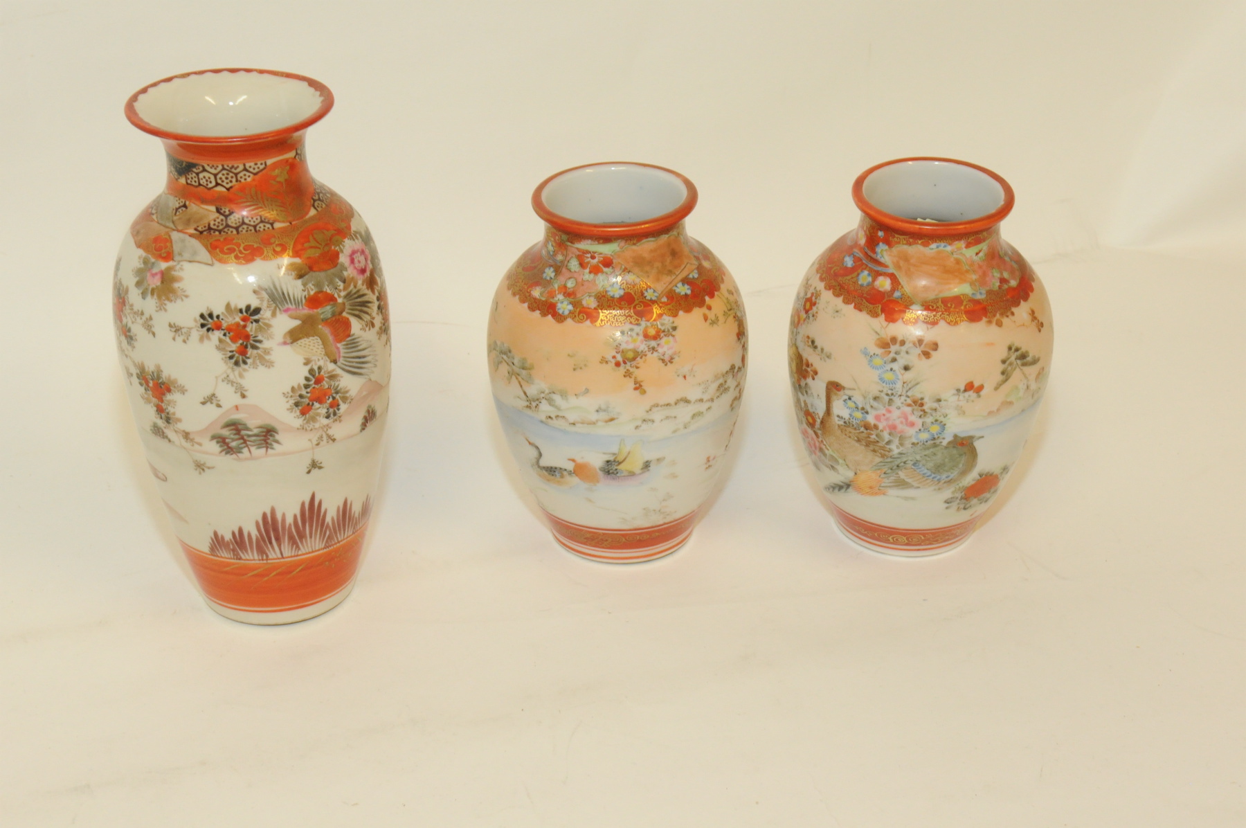 Pair of early 20th century Japanese porcelain Kutani vases of baluster form, each 6¼" high & another
