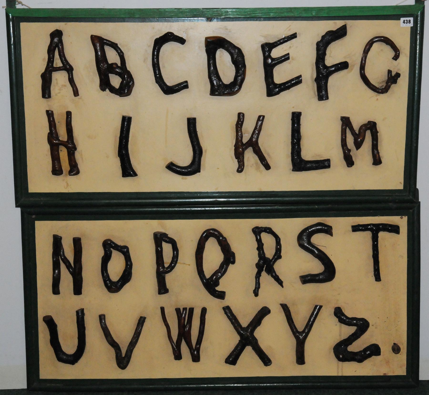 Two arboric alphabet panels, the letters made from hedgerow twigs that have grown in letter form.