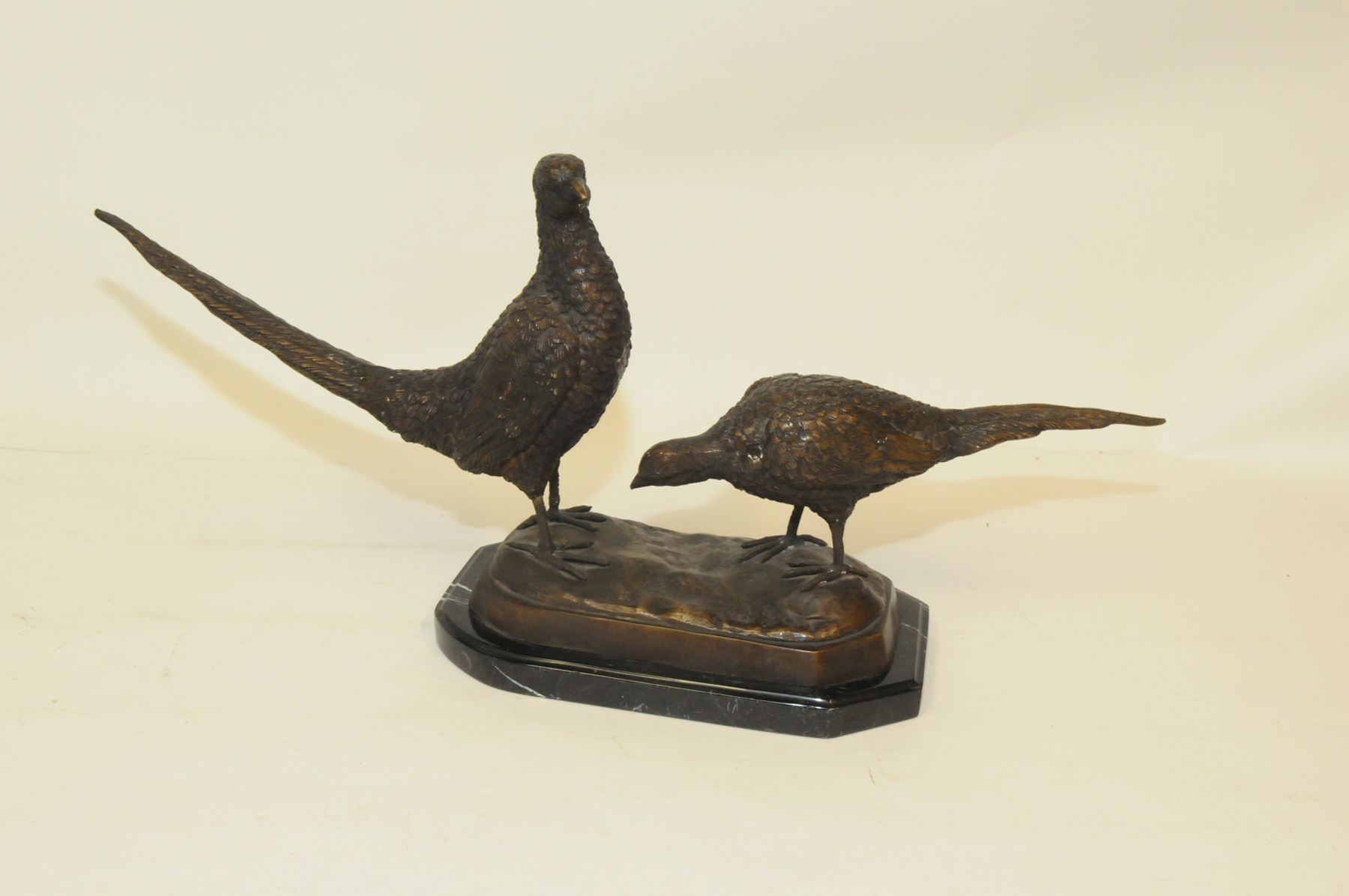 Late 19th/early 20th century cast bronze figure group of two pheasants standing on naturalistic base