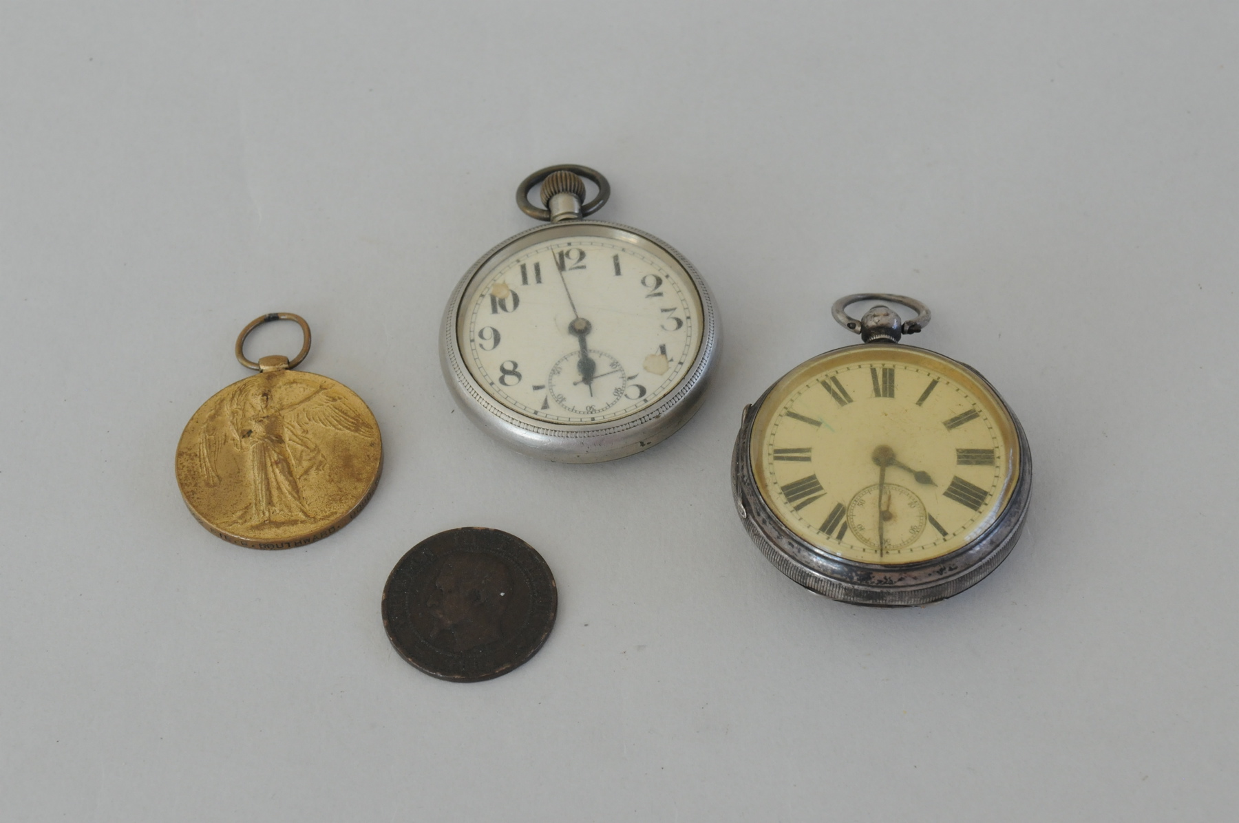 Silver lever watch, 1889; another, nickel; a medal & a coin.  (4).