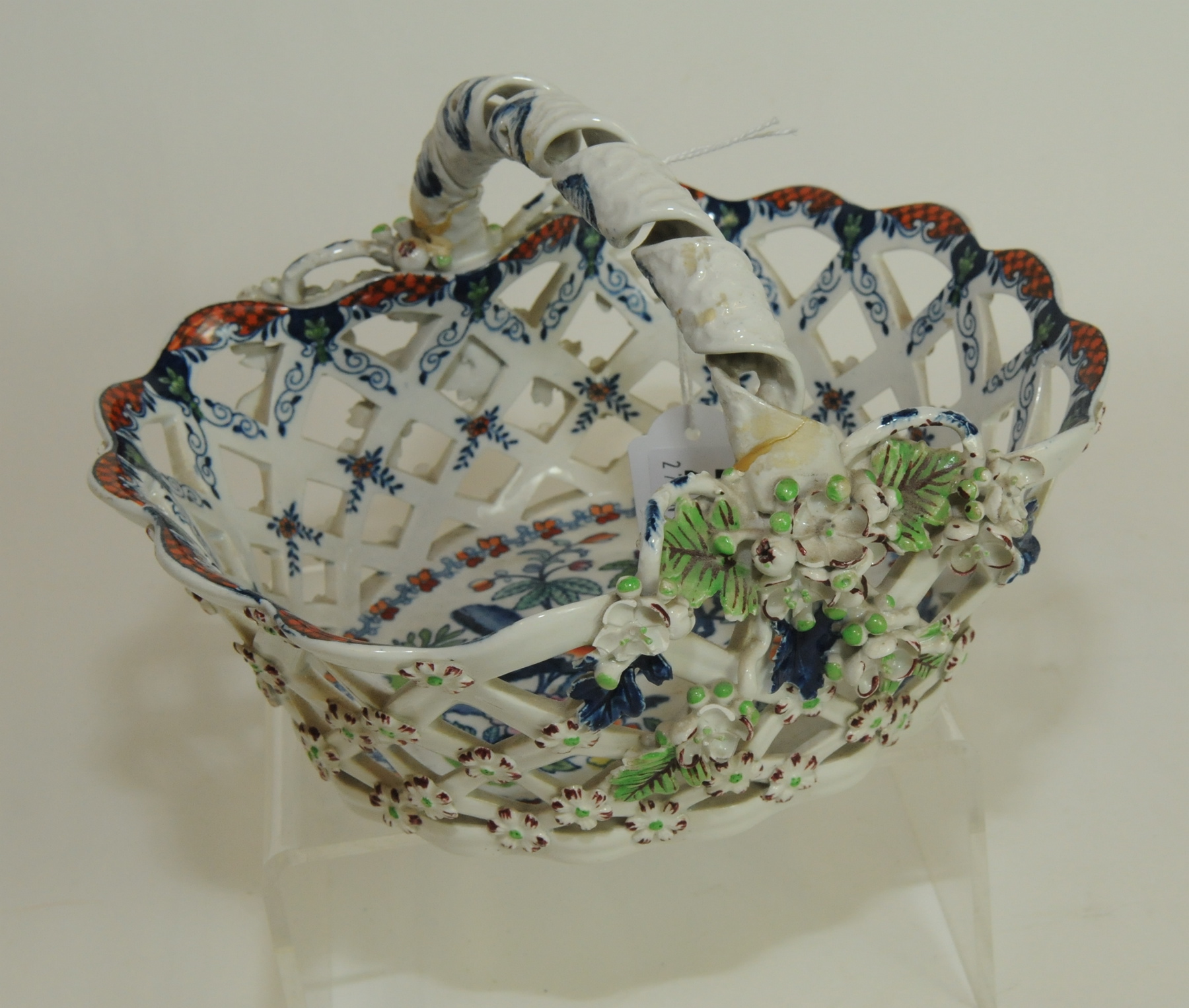 19th century pottery sweetmeat basket of pierced form, with lobed rim, hollow scrolled ribbon