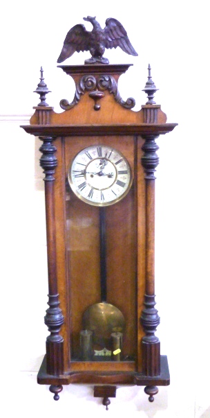 Vienna regulator clock with two piece ivory enamel dial, in walnut & stained beech case with