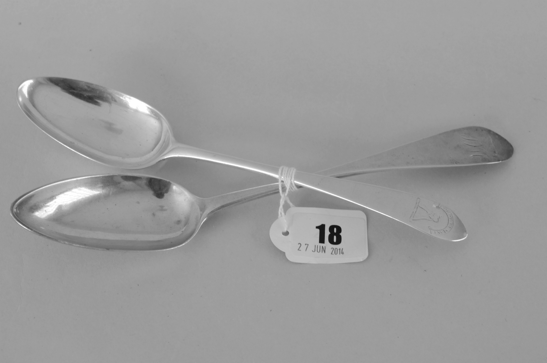 Two silver table spoons, one crested, the other initialled, Edinburgh, 1789 & 1795.