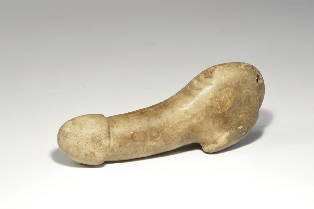 Chinese Stone Phallus20th century AD. A carved hardstone phallus pierced at the rear. 465 grams,