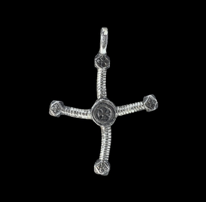 Medieval Silver-Gilt Cross Pendant13th-16th century AD. A cast bifacial pendant with four ribbed