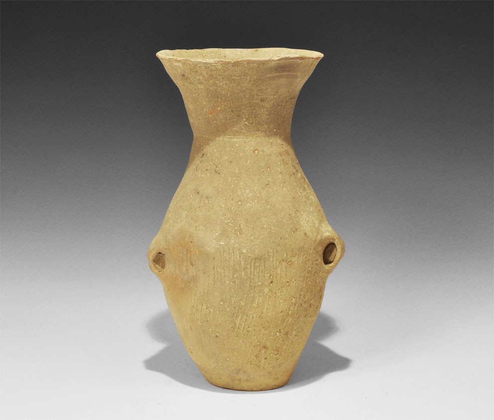 Chinese Ceramic JarNeolithic Period, 3rd millennium BC. A tall jar of biconical profile with