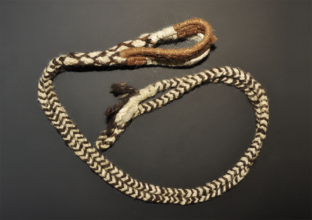 Pre Columbian Inca Fabric Slingshot1438-1532 AD. A braided textile band with round-section ends