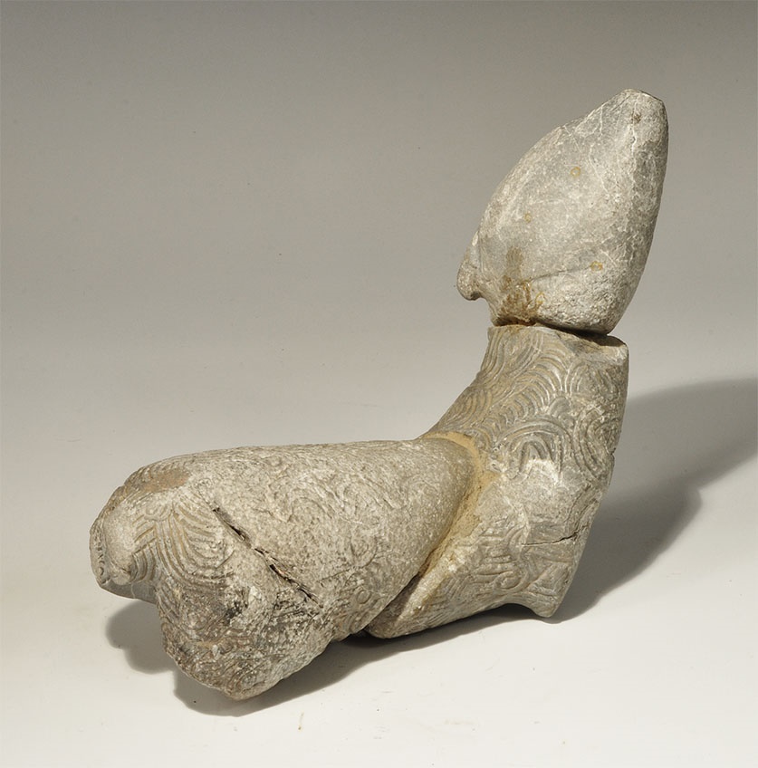 Near Eastern Stone Sheep Figurine2nd millennium BC. A carved sheep figurine with linear and scrolled