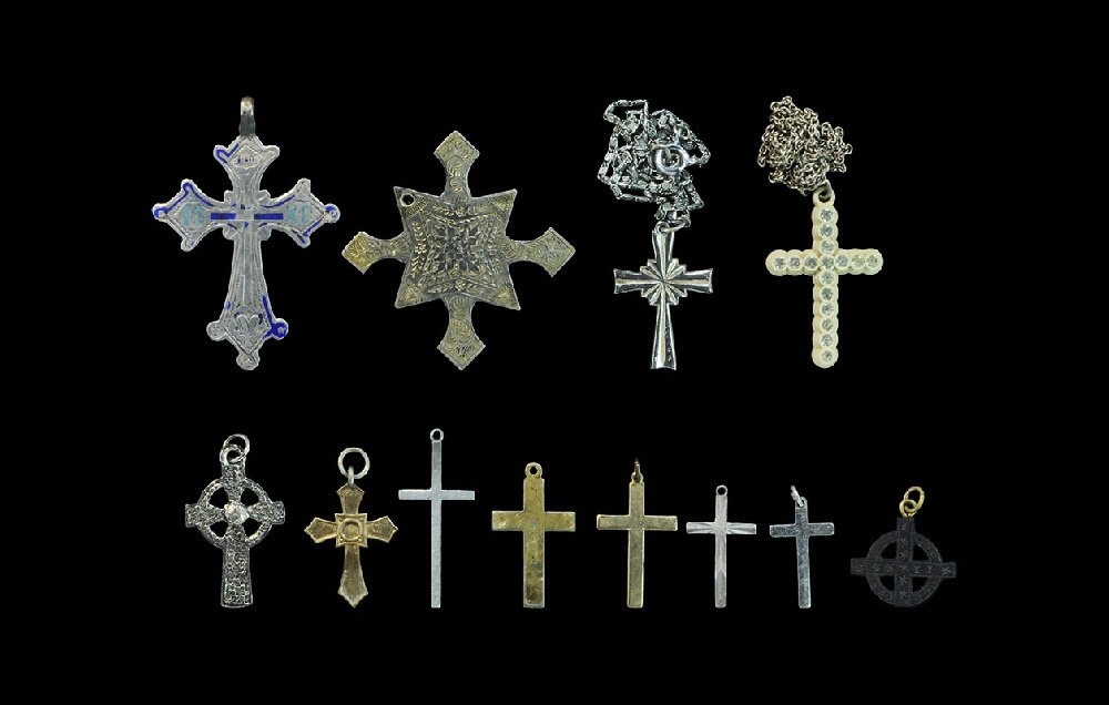 Post Medieval White Metal and Composition Cross Pendant GroupA mixed group of cruciform pendants