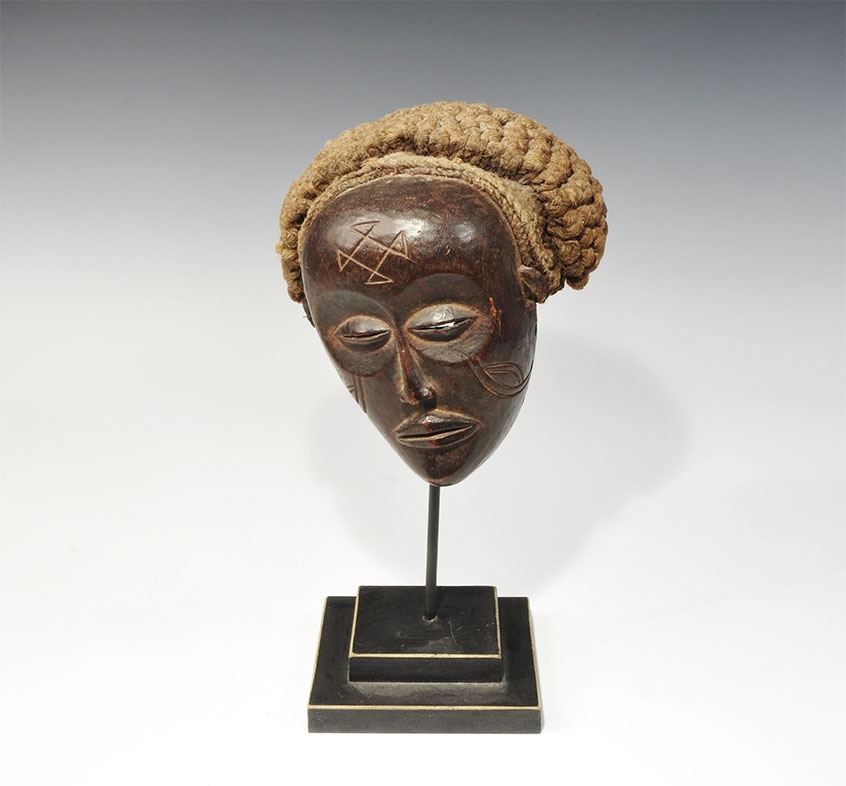 Ethnographic Congo Katasha Miniature Mask19th century AD. A carved miniature mask with slit eyes,