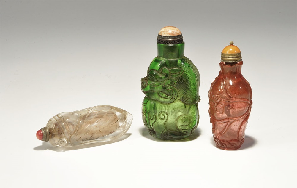 Chinese Snuff Bottle Group20th century AD. A mixed group of moulded glass bottles comprising: one