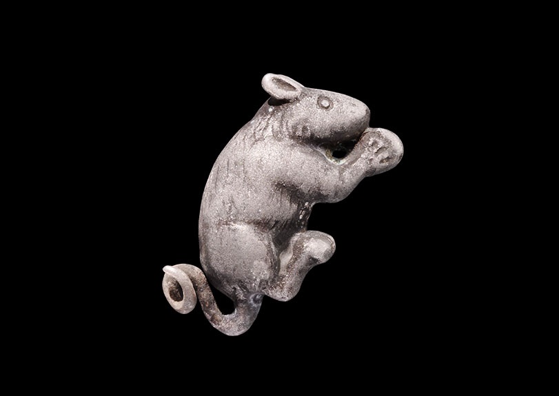 Roman Silver Mouse with Nut Figurine1st-2nd century AD. A detailed model of a mouse squatting with a