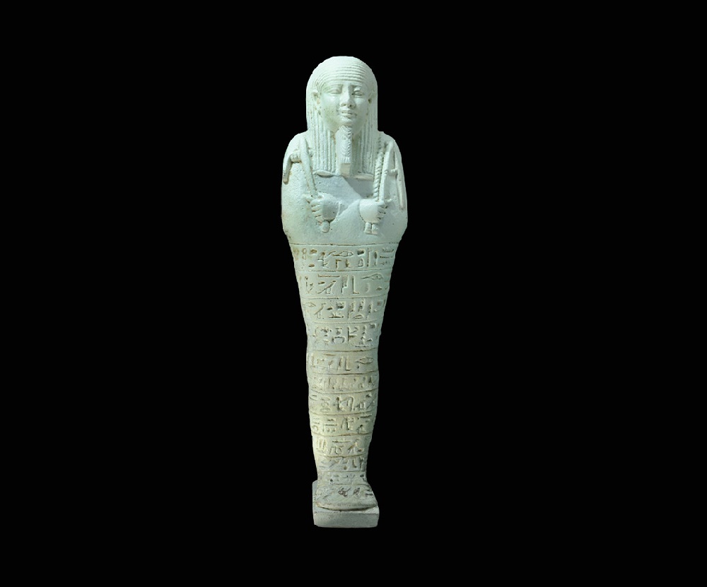Egyptian Glazed Composition `Smen Ta Wa` ShabtiLate Period, 664-332 BC. A light green, superbly-