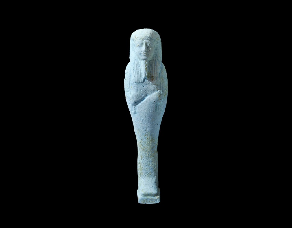 Egyptian Glazed Composition ShabtiLate Period, 664-332 BC. A finely modelled pale blue shabti with