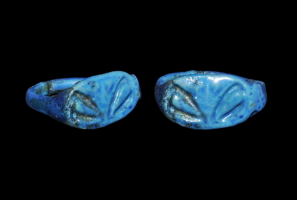 Egyptian Glazed Composition Lily Finger RingNew Kingdom, 1550-1070 BC. A bright blue flat-section