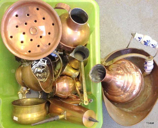 A quantity of brass and copper items, coal scuttles, jugs and others