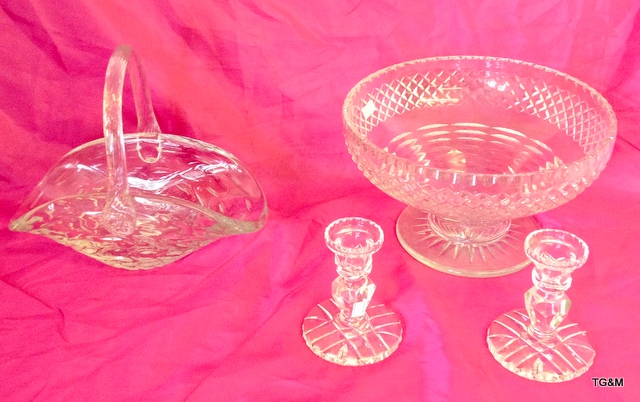 A briery glass basket, a cut glass punch bowl and a pair of candlesticks