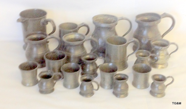 Quantity of pewter measuring and drinking tankards