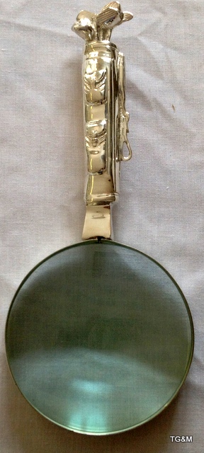 A large silver plated golf style magnifying glass