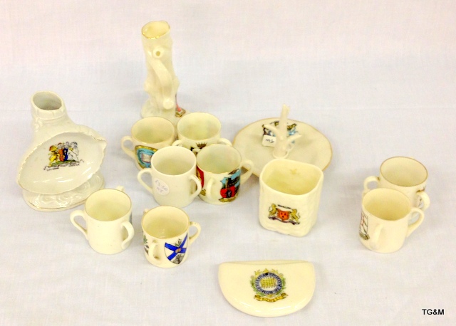 Thirteen pieces of crested china to include sporren, posy vase and a ring holder