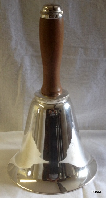 A silver plated bell shaped cocktail shaker