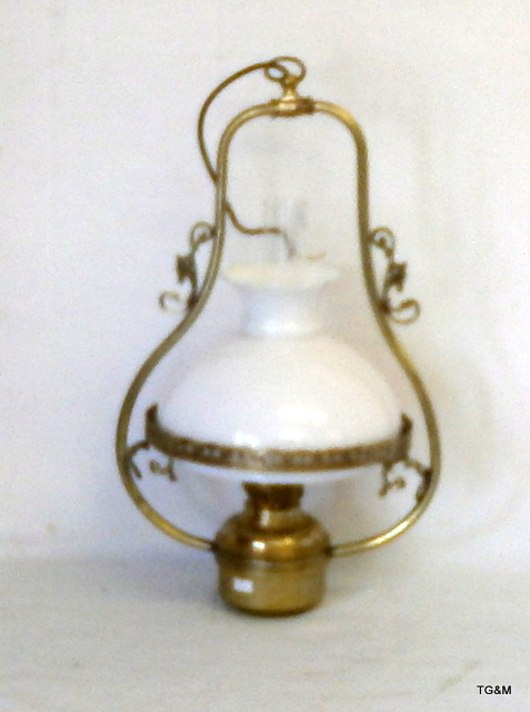A brass hurricane lamp