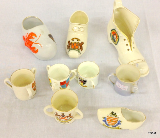 Five crested china loving cups and four crested china shoes ( one with a lobster)