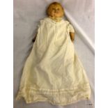 A Victorian doll with composite head and limbs