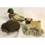 Three ceramic figures of a Hedgehog, Pug dog and Mallard duck