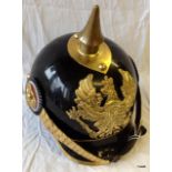 A good quality reproduction brass and metal WW1 German pickelhaube helmet