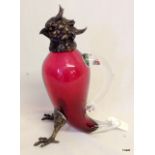 A Bronze and cranberry glass claret jug in the form of a Parrot